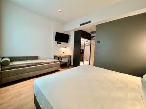 Postel nebo postele na pokoji v ubytování Hotel Leonessa