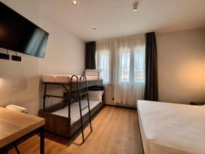 Postel nebo postele na pokoji v ubytování Hotel Leonessa