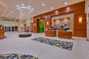 a lobby of a hotel with a reception desk at Hampton Inn & Suites Owensboro Downtown Waterfront in Owensboro