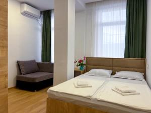 Postel nebo postele na pokoji v ubytování Hotel mia Telavi