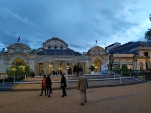 a group of people walking in front of a building at Dans colombier proche de Vichy parking privé in Vichy