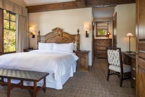 a bedroom with a large bed and a desk and chair at Hotel Park City, Autograph Collection in Park City