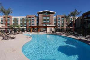 a large swimming pool in front of a hotel at Homewood Suites by Hilton Phoenix Chandler Fashion Center in Chandler