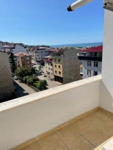 a balcony with a view of a city at Kanarya Apart in Trabzon