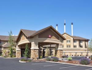 a rendering of a hotel building with a parking lot at Hilton Garden Inn Bend in Bend
