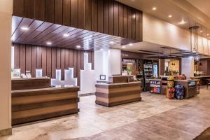 a store lobby with a counter and a grocery store at Hilton Garden Inn Bend in Bend