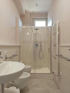 a bathroom with a shower and a sink and a toilet at Colombo 477 Auditorium in Civitanova Marche +31 photos