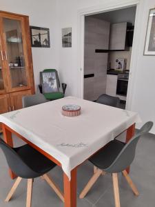 a white table and chairs in a kitchen at CARPE DIEM in Oristano