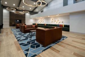 a lobby with couches and a waiting room at DoubleTree by Hilton Bakersfield in Bakersfield