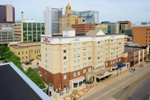an aerial view of a building in a city at Hilton Garden Inn Rochester Downtown in Rochester