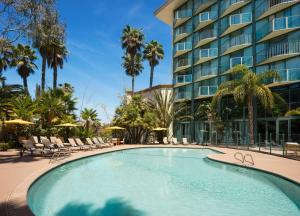 a swimming pool in front of a hotel at DoubleTree By Hilton San Diego Hotel Circle in San Diego