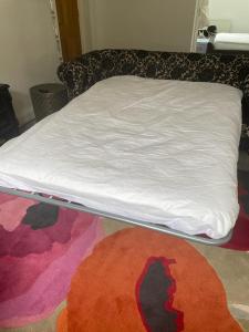 En eller flere senge i et værelse på Selwood Cottage Annex