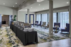 a dining room with tables with plates on them at DoubleTree by Hilton San Antonio Downtown in San Antonio +29 photos
