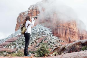 a woman taking a picture of the grand canyon at Hilton Sedona Resort at Bell Rock in Sedona