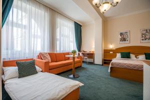 Posteľ alebo postele v izbe v ubytovaní Hotel Arcus Garden