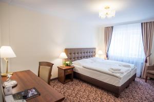 Postel nebo postele na pokoji v ubytování WINDSOR SPA Hotel