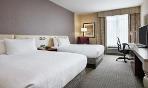 a hotel room with two beds and a television at Hilton Garden Inn San Francisco Airport North in South San Francisco +45 photos