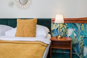 Posteľ alebo postele v izbe v ubytovaní Hotel Arcus Garden