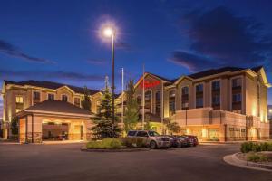 a hotel with cars parked in front of a parking lot at Hilton Garden Inn Salt Lake City Downtown in Salt Lake City