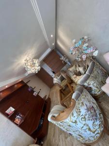 an overhead view of a living room with a couch and a table at Tamaris (Dar bouaaza) in Dar Bouazza