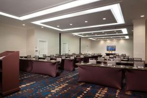 a large room with rows of desks and chairs at Hilton St. Petersburg Bayfront in St Petersburg