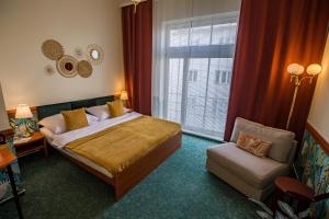 Posteľ alebo postele v izbe v ubytovaní Hotel Arcus Garden