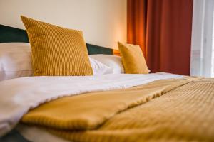 Posteľ alebo postele v izbe v ubytovaní Hotel Arcus Garden