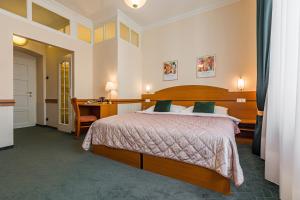 Posteľ alebo postele v izbe v ubytovaní Hotel Arcus Garden