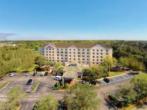 an aerial view of a hotel with a parking lot at Hilton Garden Inn Tampa North in Tampa