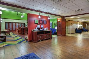 a large lobby with a waiting room and a waiting area at Hampton Inn & Suites Owasso in Owasso