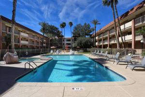 a swimming pool in front of a building at DoubleTree Suites by Hilton Tucson Airport in Tucson
