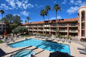 a swimming pool in front of a hotel at DoubleTree Suites by Hilton Tucson Airport in Tucson