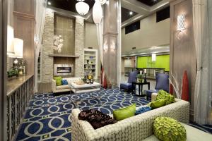 a lobby with a couch and chairs and a fireplace at Hilton Garden Inn Texarkana in Texarkana