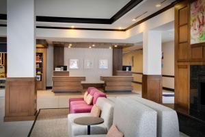 a lobby with a couch and a waiting room at Hilton Garden Inn Tyler in Tyler