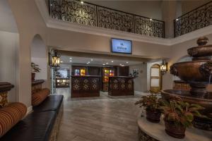 a lobby of a hotel with a large vase at Hilton Saint Augustine Historic Bayfront in St. Augustine