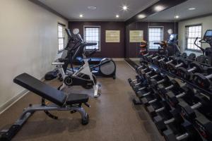 a gym with treadmills and exercise bikes in a room at Hilton Saint Augustine Historic Bayfront in St. Augustine