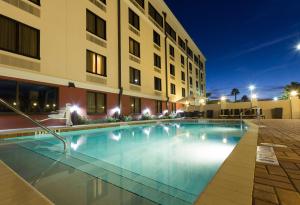 a swimming pool in front of a building at night at DoubleTree by Hilton St. Augustine Historic District in St. Augustine