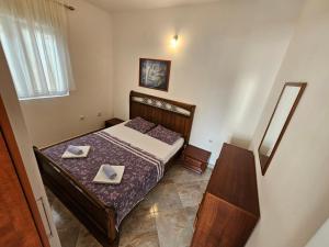 Postel nebo postele na pokoji v ubytování Apartmani Vanja 1