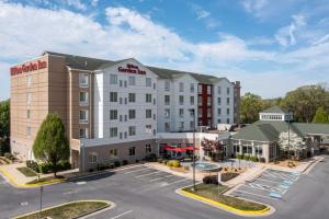 an aerial view of a hotel with a parking lot at Hilton Garden Inn Winchester in Winchester