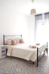 Postel nebo postele na pokoji v ubytování NERI Rooms