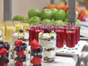 a group of jars filled with desserts and fruit at DoubleTree by Hilton West Edmonton in Edmonton