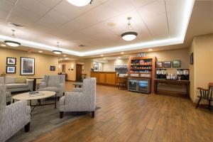 a waiting room at a hospital with chairs and tables at Hampton Inn Waterville in Waterville