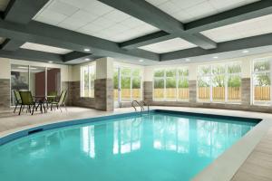 a large swimming pool in a hotel room at Hilton Garden Inn Kitchener/Cambridge in Cambridge