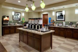 a lobby with a counter with wine bottles on it at Hampton Inn & Suites Blythe, CA in Blythe