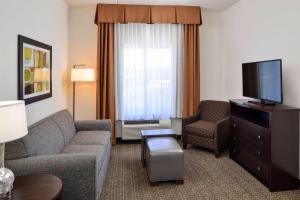 a living room with a couch and a tv at Homewood Suites by Hilton Columbia/Laurel in Laurel