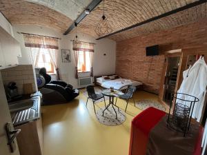 a living room with a brick wall at Zelený grunt in Dřínov