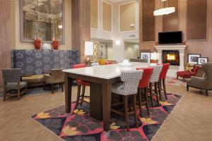 a living room with a table and chairs at Hampton Inn & Suites Munster in Munster