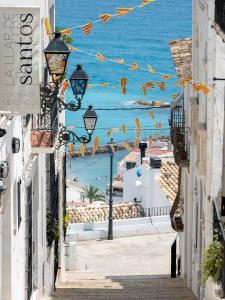 a street in positano with a view of the ocean at Hostal Perla Blanca Altea in Altea