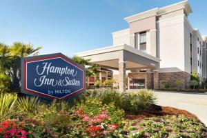 a sign for the hampton inn and suites at Hampton Inn and Suites Monroe in Monroe