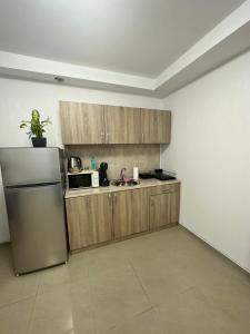 Kuchyň nebo kuchyňský kout v ubytování Green Central Apartment